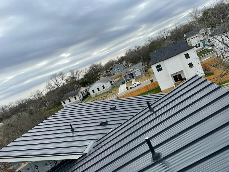 Standing seam metal roof panels with vents for Skylight Repair in Denville